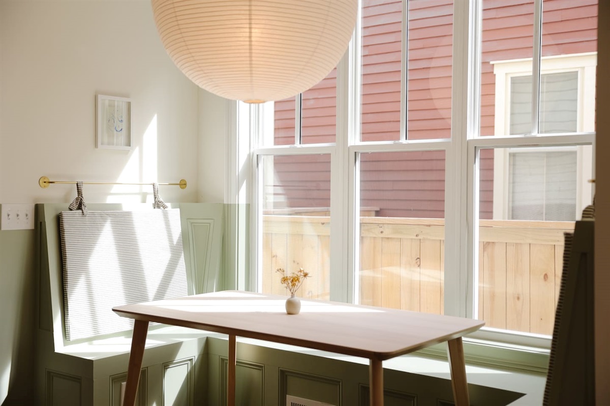 The breakfast nook may be our favorite part of the house. Featuring custom cushions and the oversized rice paper lantern from Hay. It's a great place to share a coffee or take a meeting.