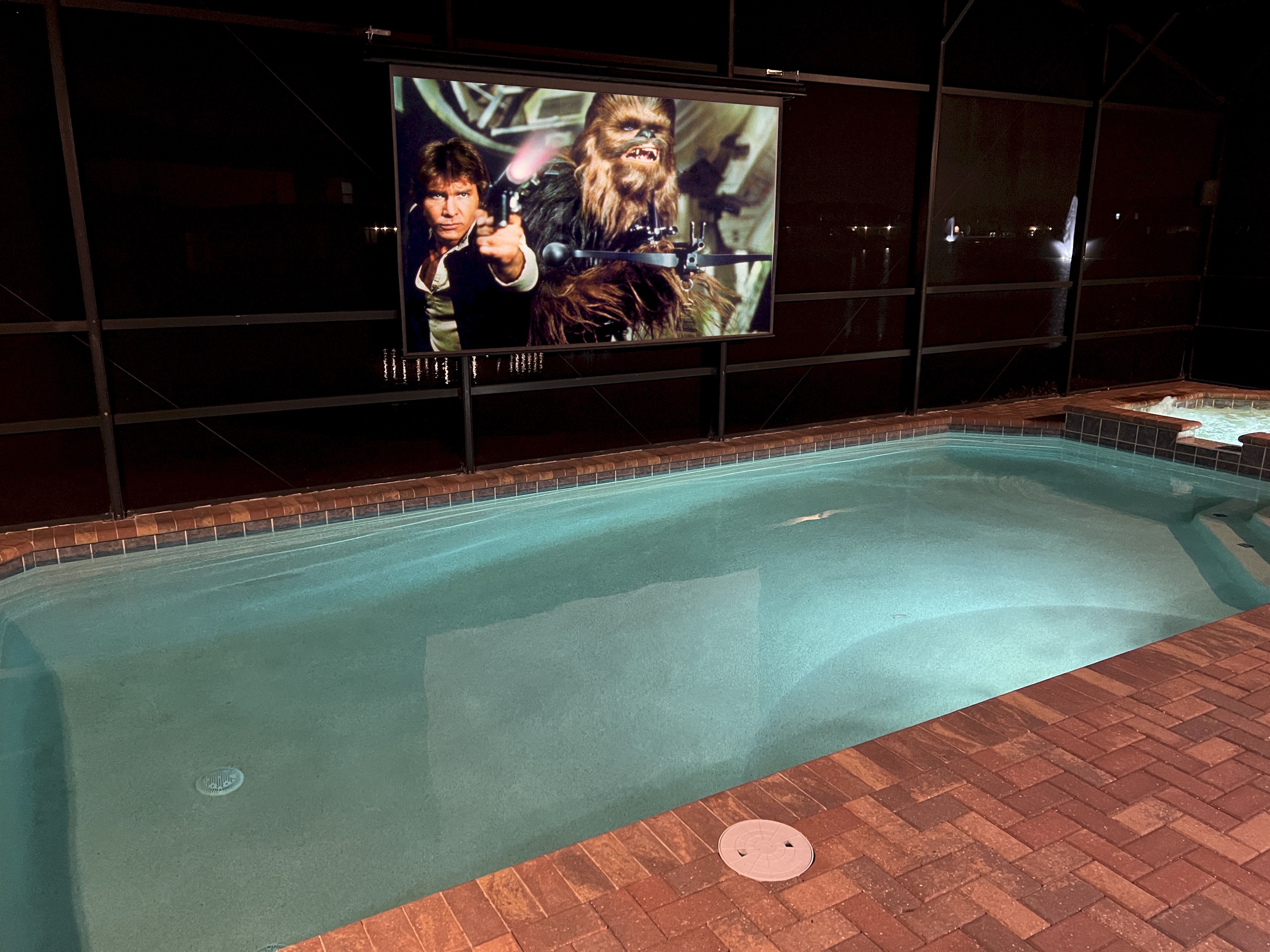Watch Movies And Television At Night On The Poolside Theater