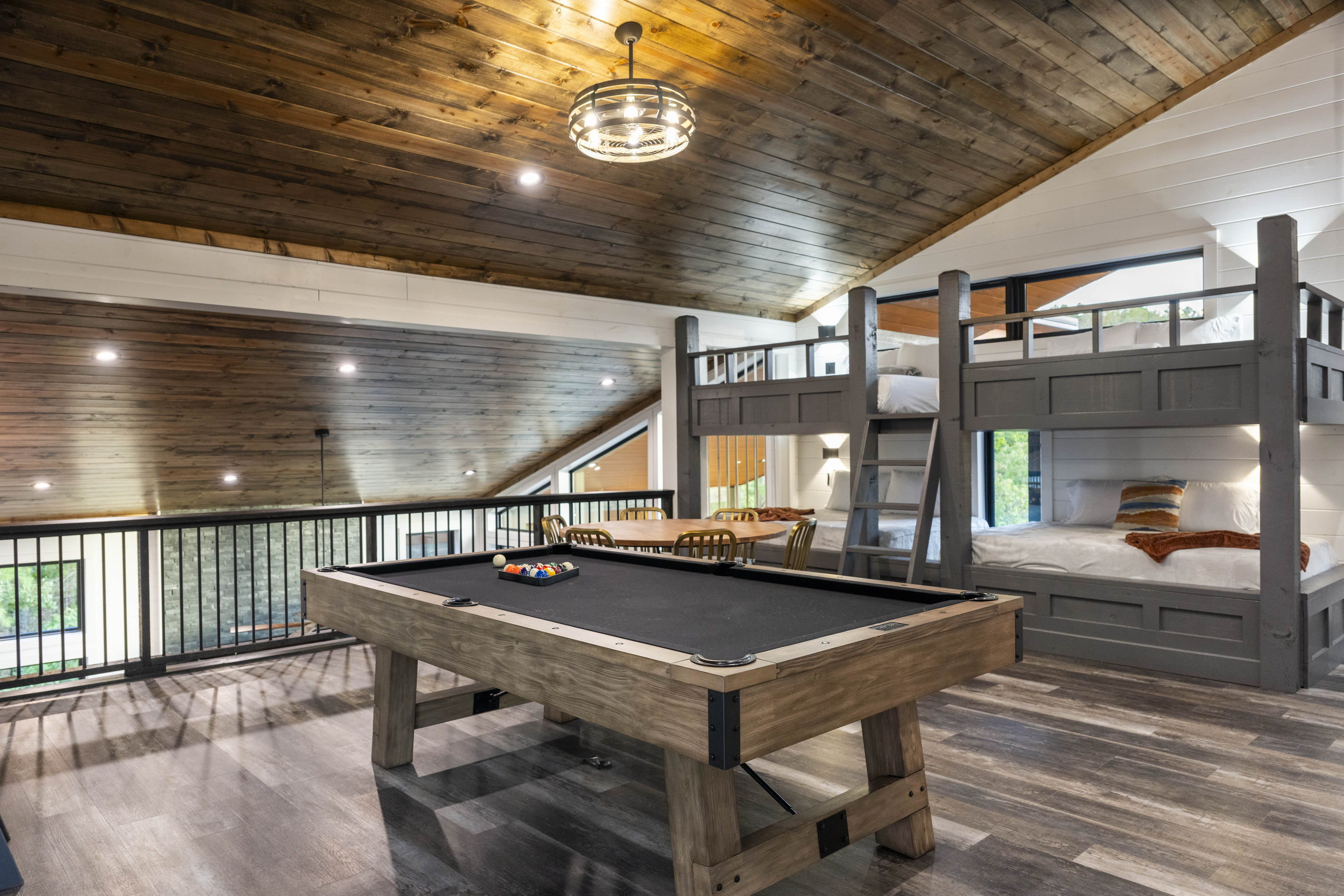 Fun filled game room designed for guests of all ages. Challenge to a game of pool, gather around a dedicated game table for cards or board games