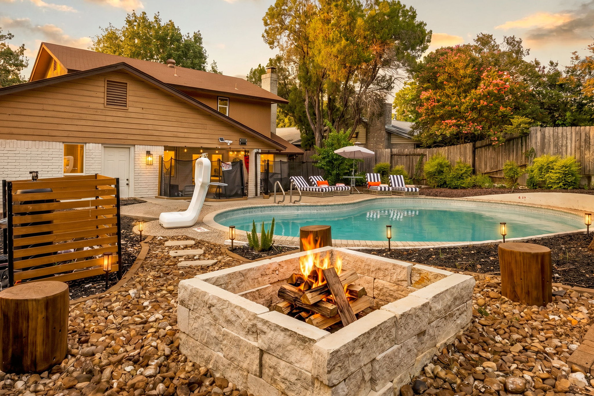 From sunny afternoons to fireside evenings, this backyard is designed for relaxation.