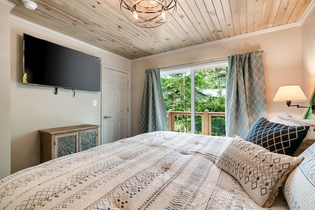 Comfort with a view. Enjoy your favorite shows from the plush King bed, then step out onto your private outdoor space.