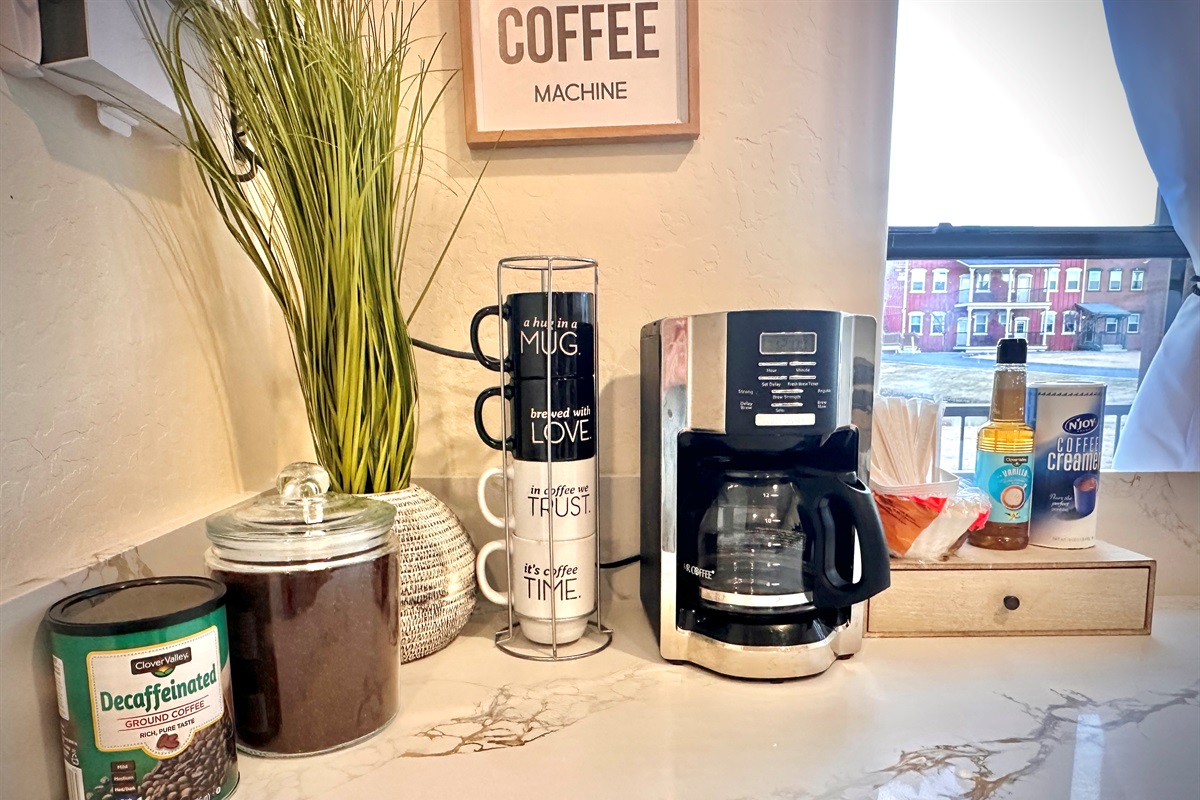 Coffee bar with complimentary coffee, sugar, and creamer