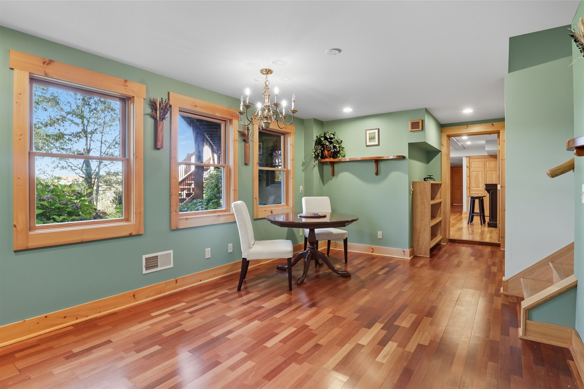 Light-filled bonus room with hardwood floors.