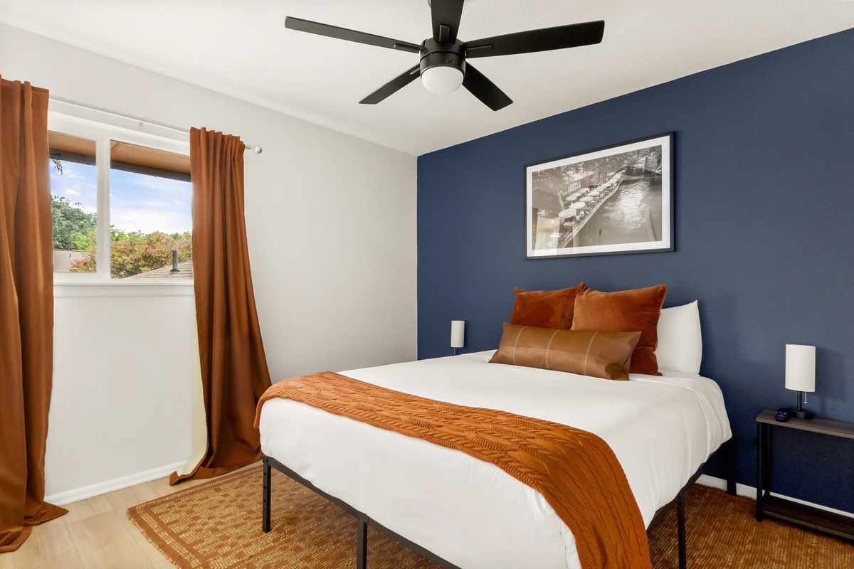Thoughtfully designed for relaxation with luxurious bedding, bedside lighting, and elegant décor.