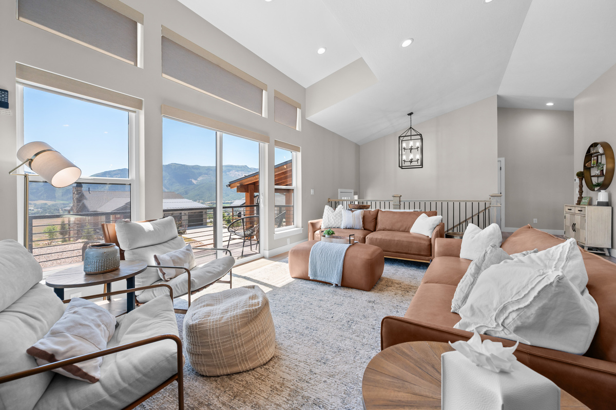 Wall-to-wall windows fill the great room with natural light and showcase beautiful mountain views year-round.