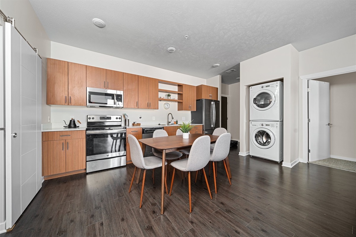 Open floorplan with dining for 6, full kitchen including dishwasher and washer and dryer in-unit for personal use