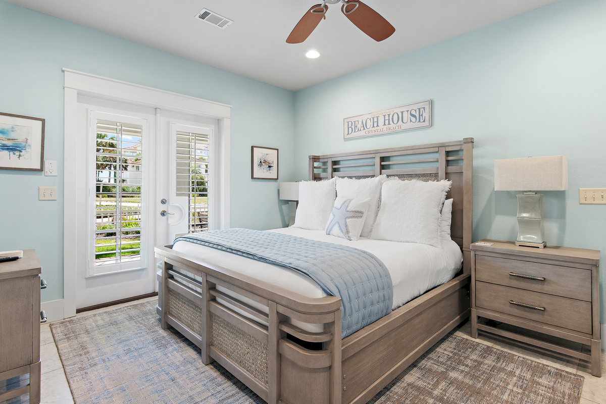 Relax in this beautifully appointed coastal bedroom, featuring a comfortable king bed and soothing beach inspired décor.