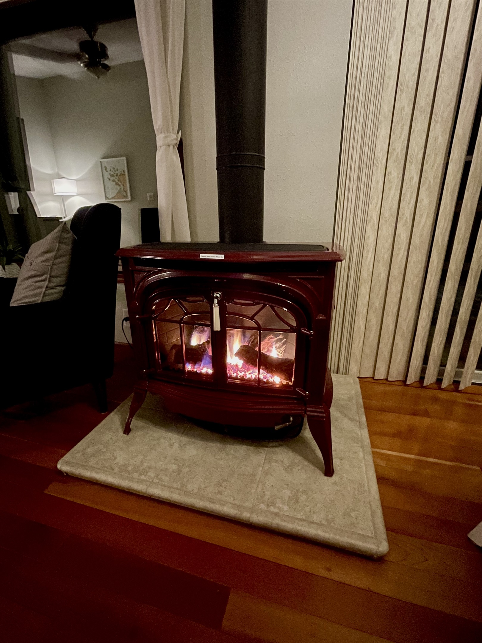 Evening photo of propane lit fireplace with heat wall thermostat controlled. A perfect way to set the mood and get cozy.