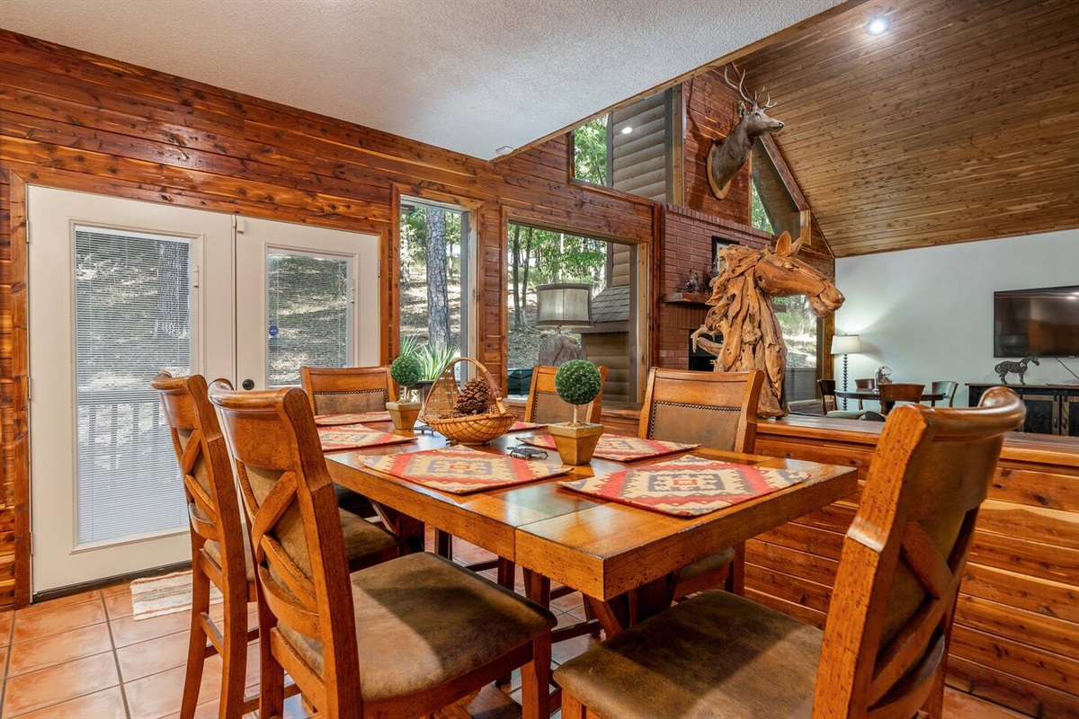 Cornucopia Dining Area featuring a stylish bar-height dining table that comfortably seats six. It's the perfect space for sharing laughter, good food, and great company.