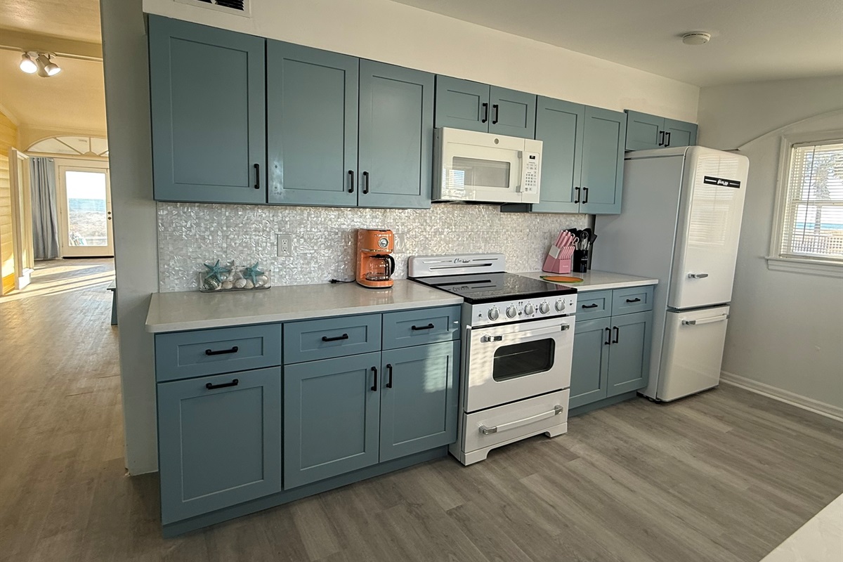 Blue Kitchen Cabinets with Retro Appliances and Mother of Pearl Backsplash!