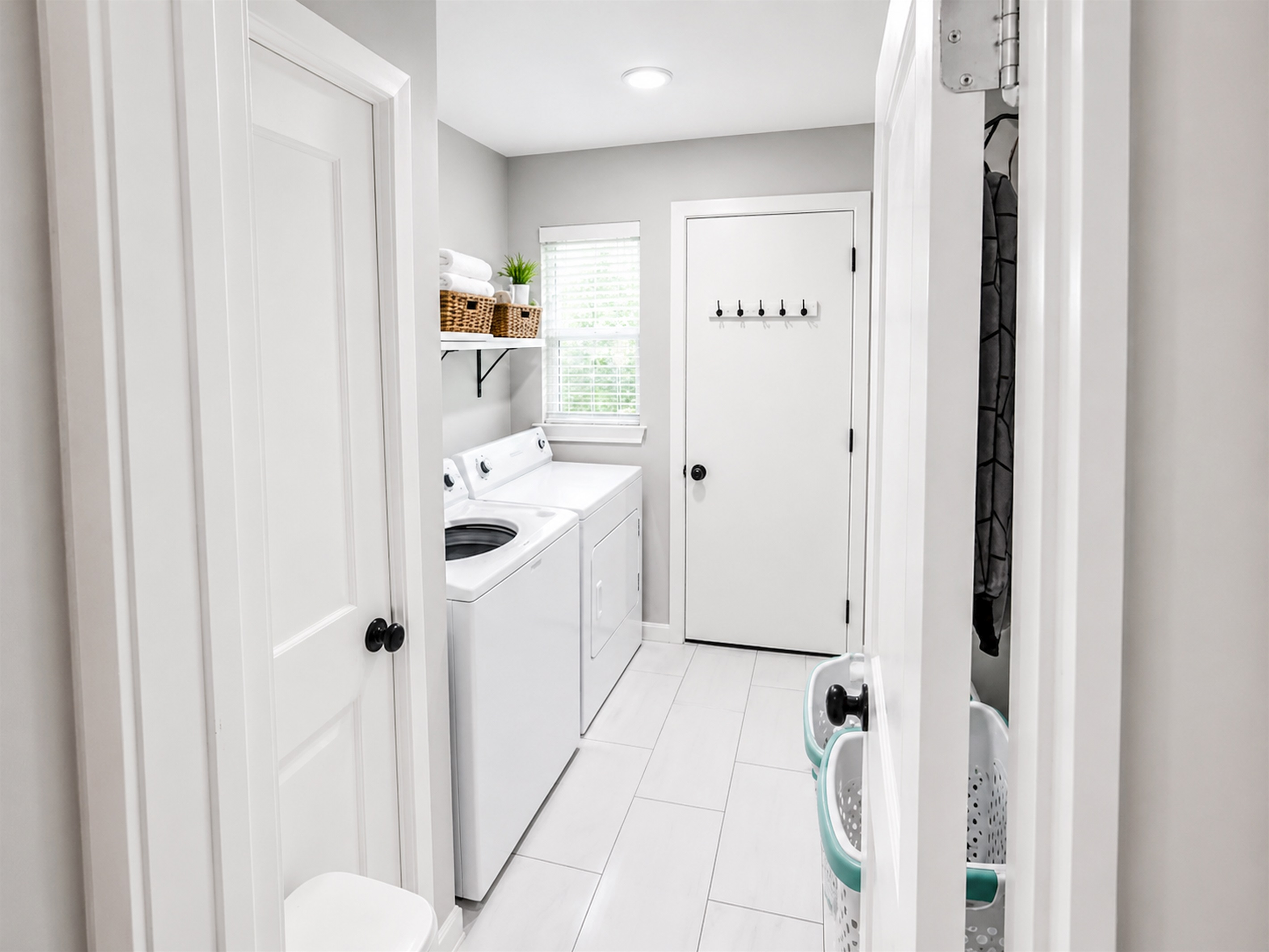 Dedicated laundry room with full-size washer and dryer — perfect for extended stays and family travel
