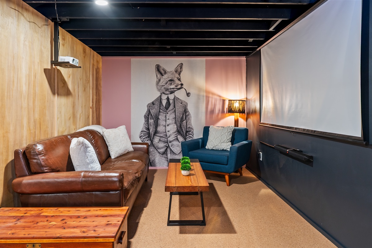 Cozy lower-level lounge with stylish design, perfect for movie nights or relaxing indoors.