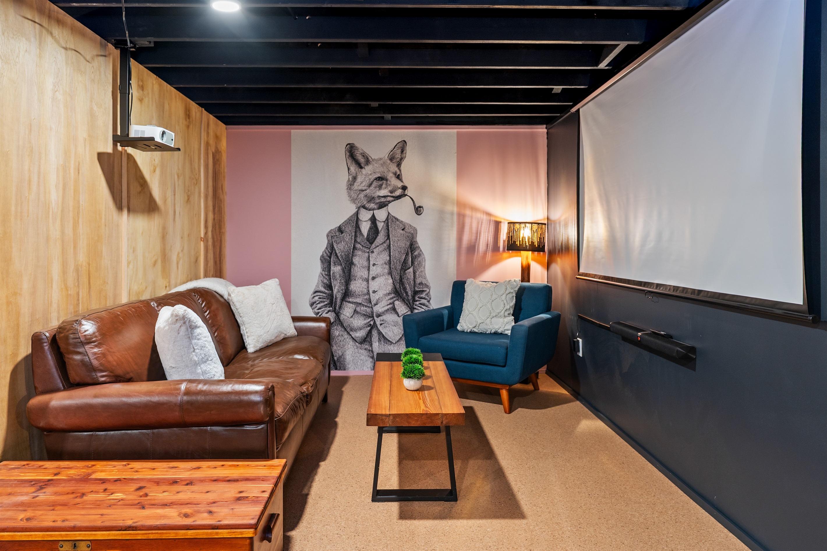 Cozy lower-level lounge with stylish design, perfect for movie nights or relaxing indoors.