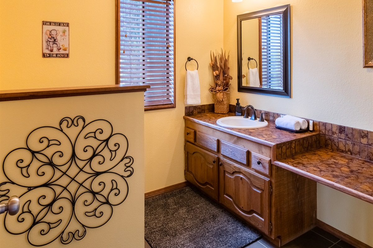 Main floor powder room located near the kitchen and great room.