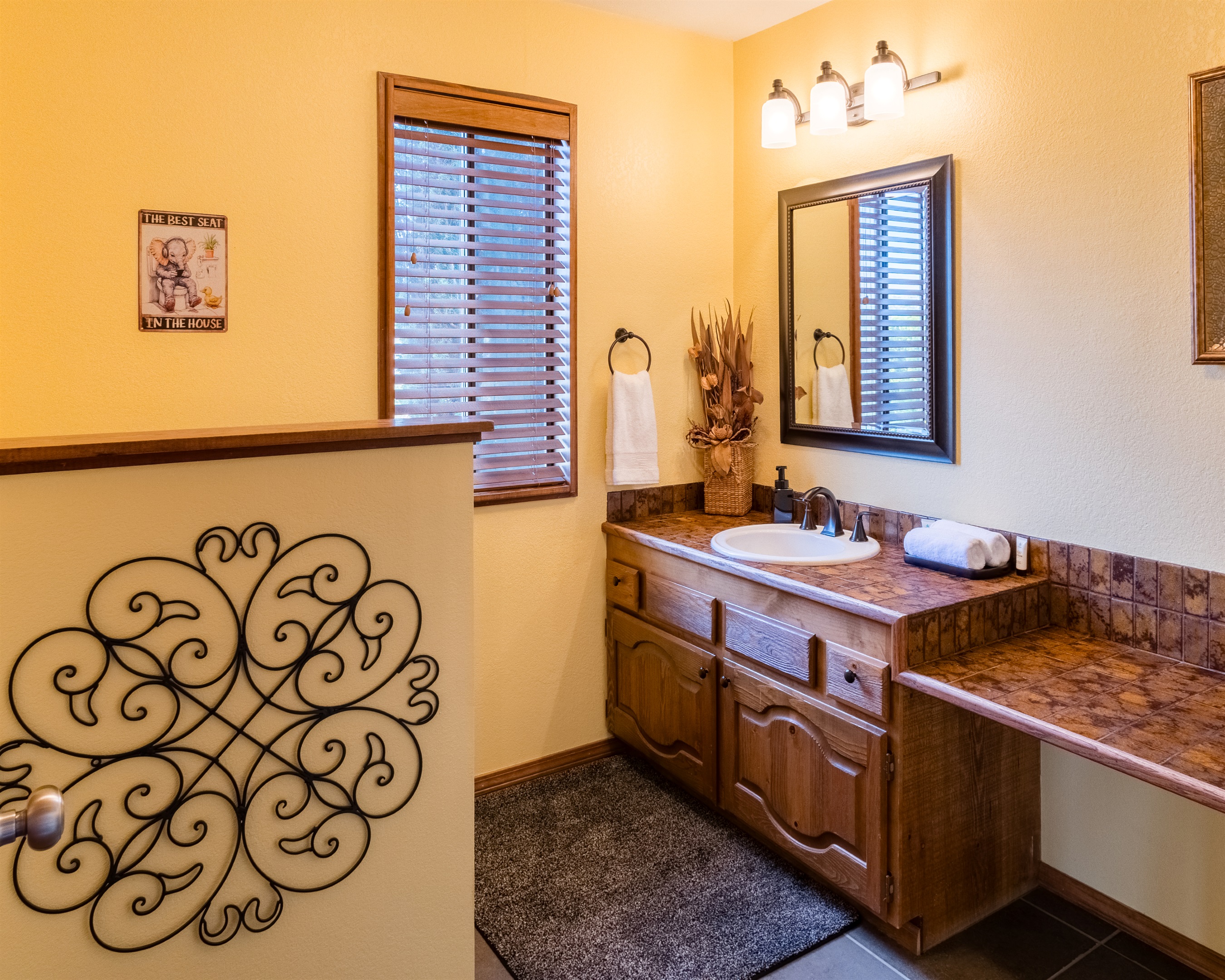 Main floor powder room located near the kitchen and great room.