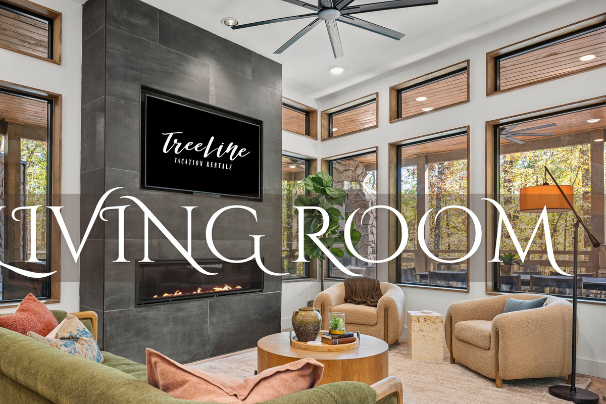 This cozy living room combines plush seating with scenic forest views, making it the perfect spot to relax and unwind after a day of mountain adventures.