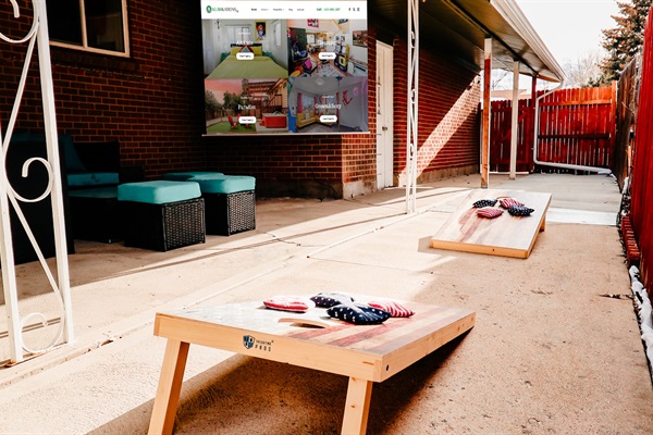 Backyard Bliss: Enjoy Outdoor Entertainment with Cornhole and Movie Nights Under the Stars!