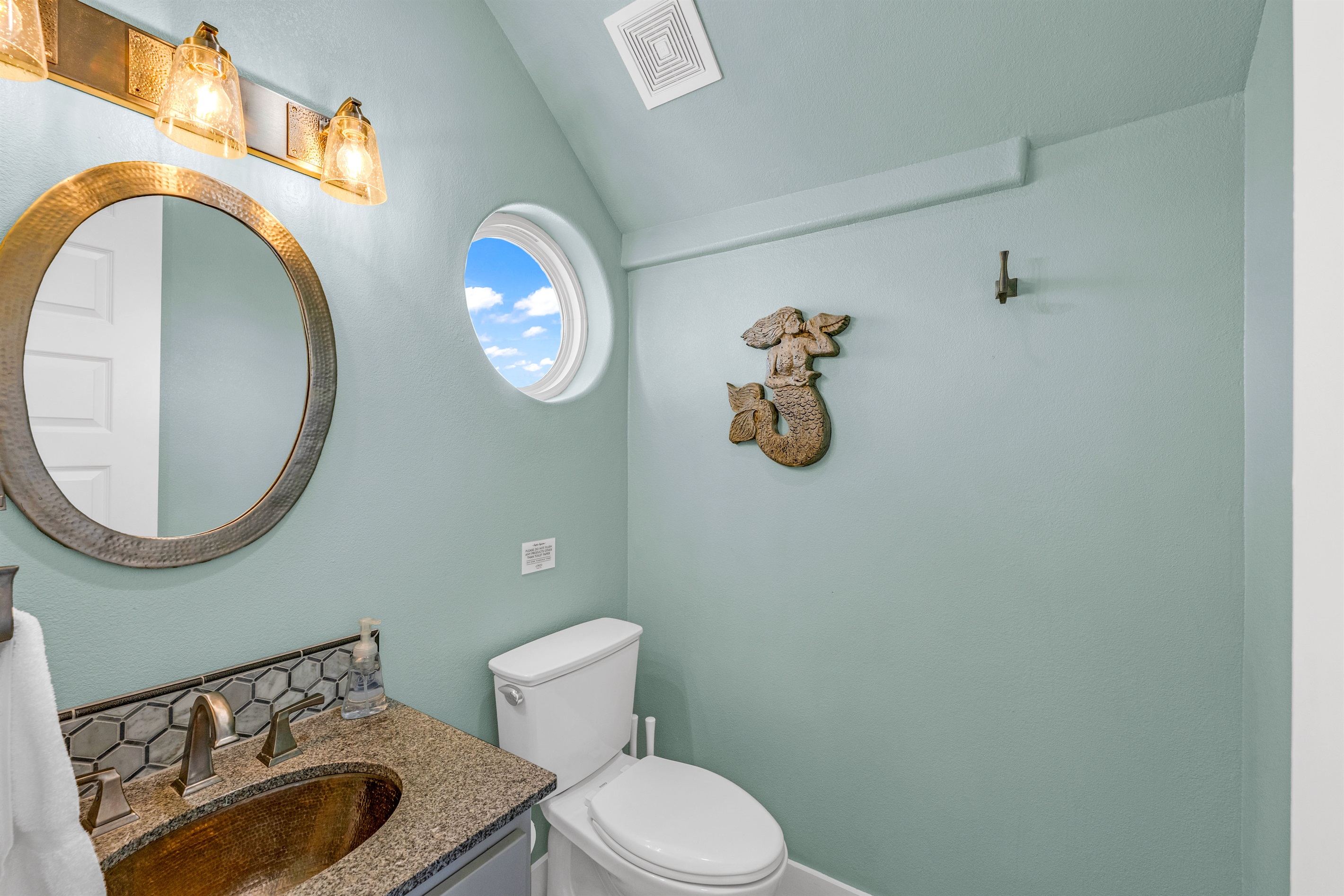 Crystal Paradise Bathroom 1: Guest-ready powder room combining style and practicality.