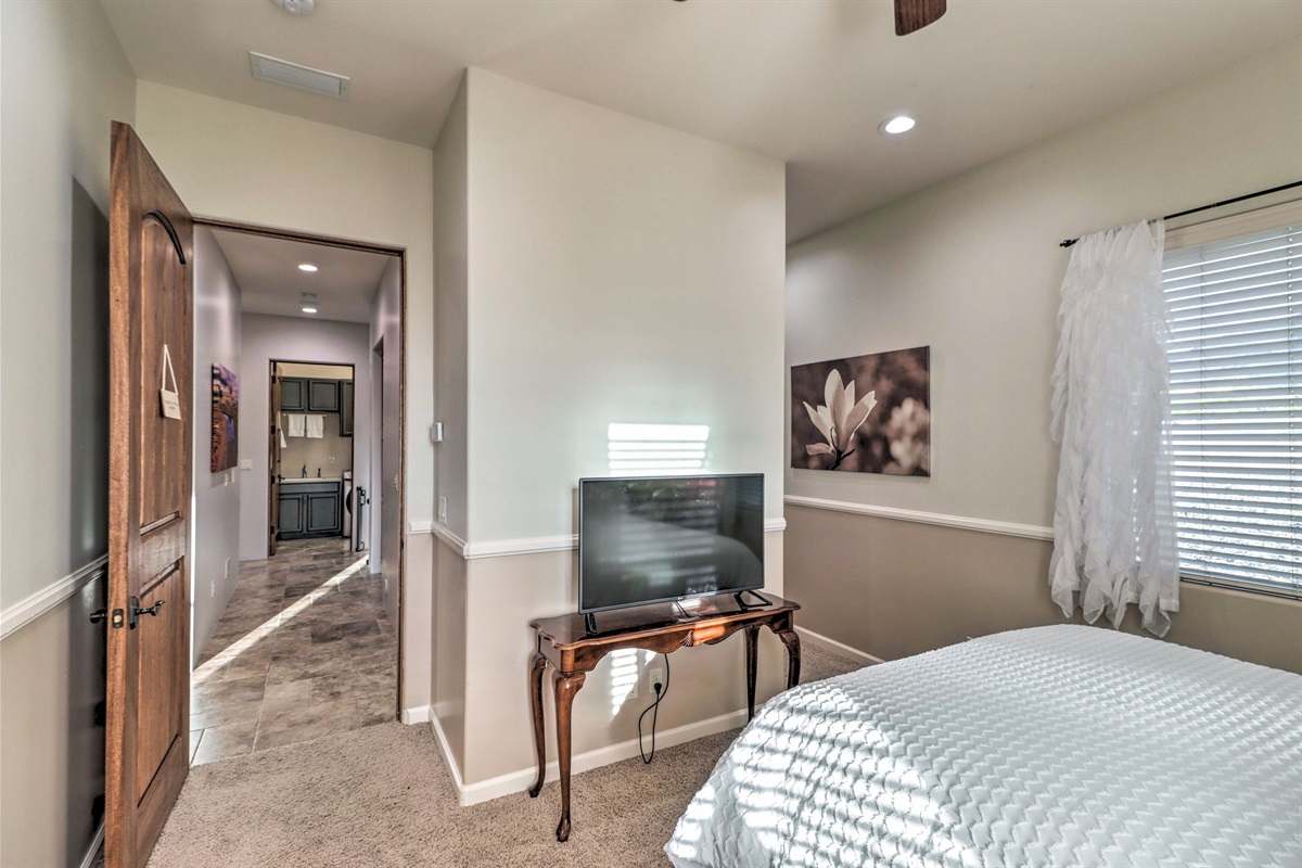 Comfortable first-floor queen bedroom with Smart TV and easy access to nearby full bathroom
