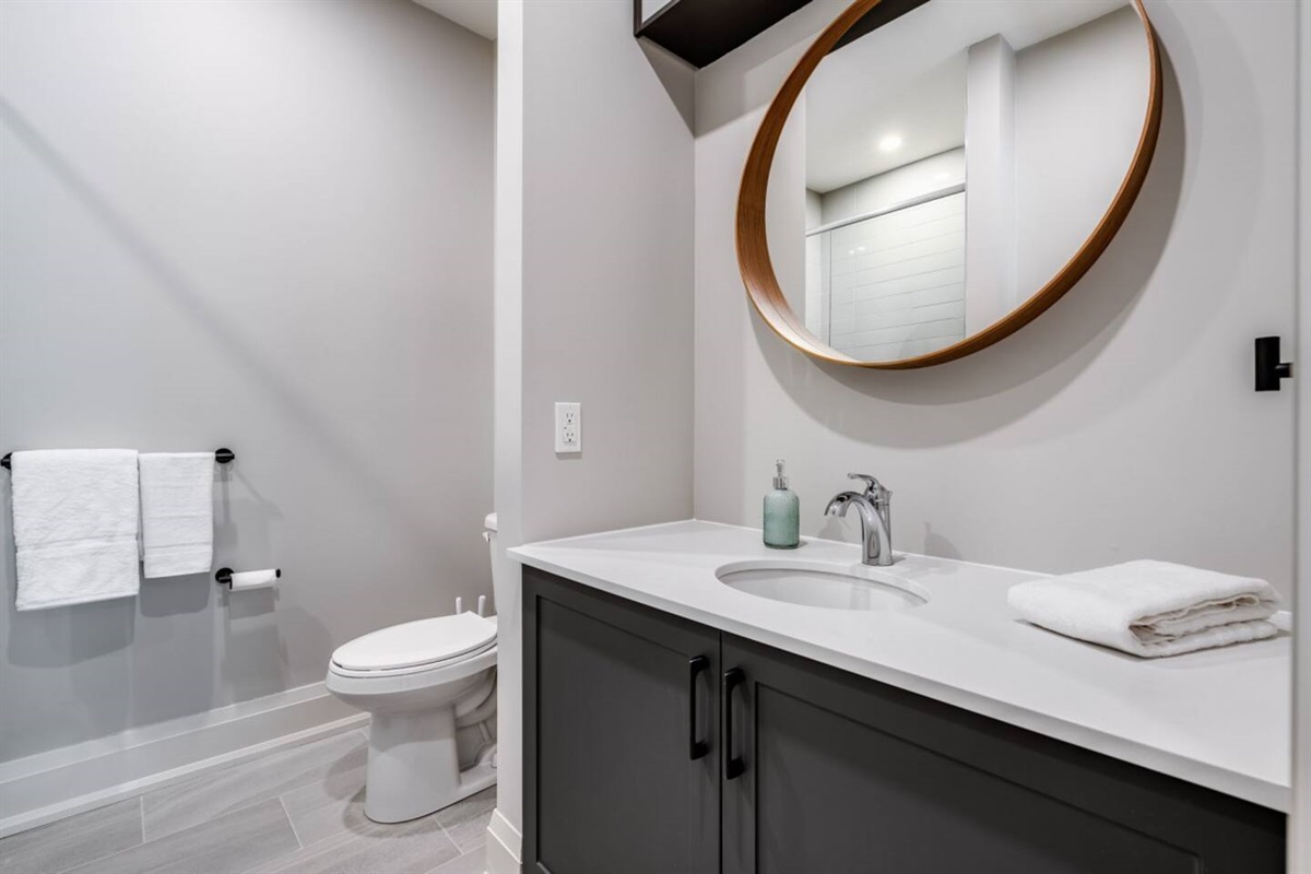 A private ensuite with a walk-in shower completes the upstairs king retreat.