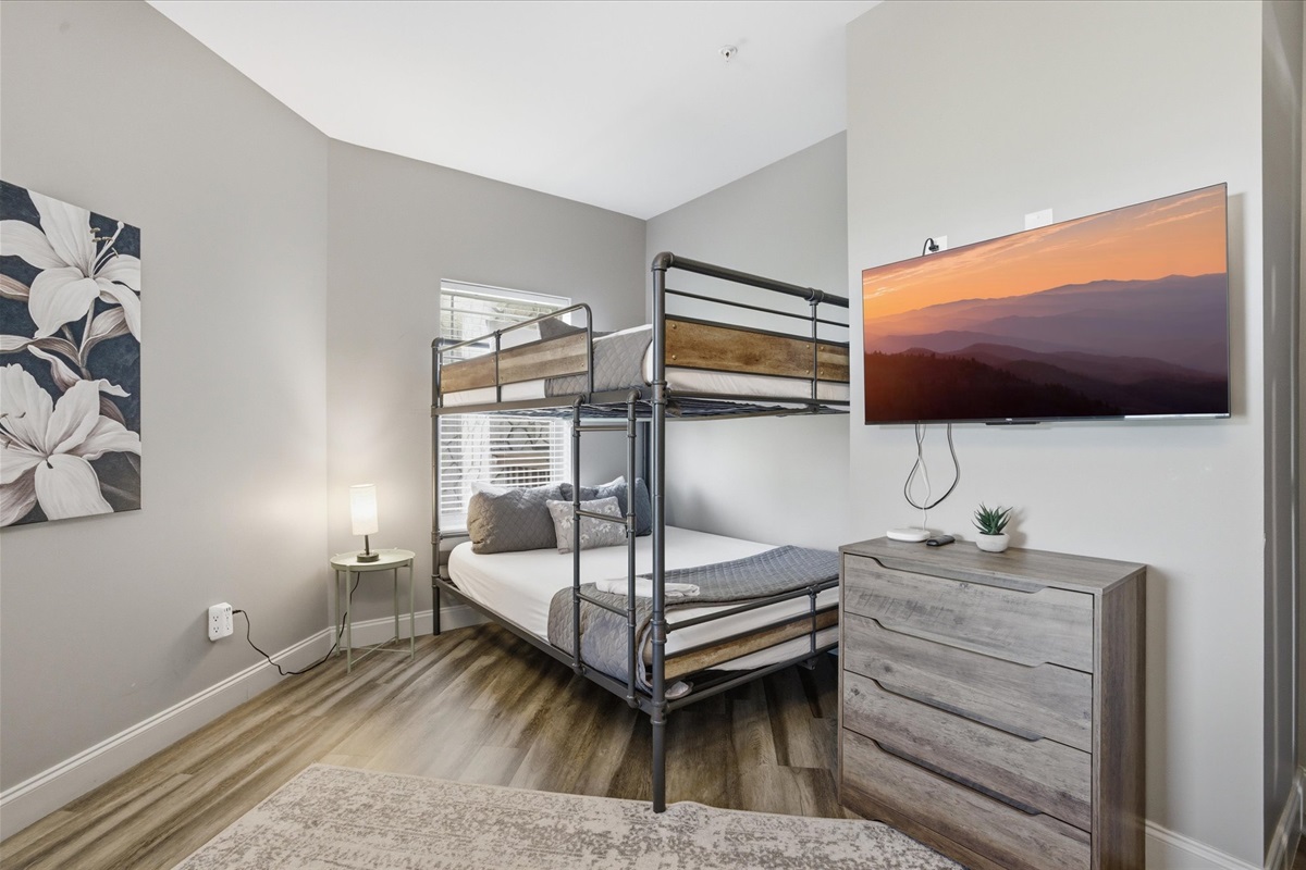 Don’t miss the extra bunk tucked in the corner—perfect for a little more privacy or claiming your own spot away from the rest. Same comfort, just a quieter corner of the room.