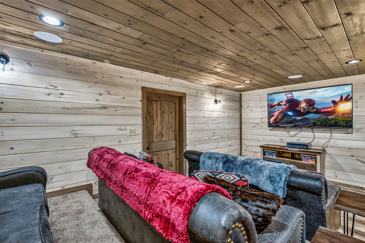 Family-friendly theater room with 75 inch Roku 