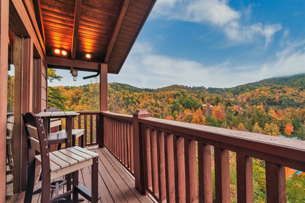 Bask in the beauty of autumn from your private deck, where comfortable seating and colorful foliage create the perfect retreat.