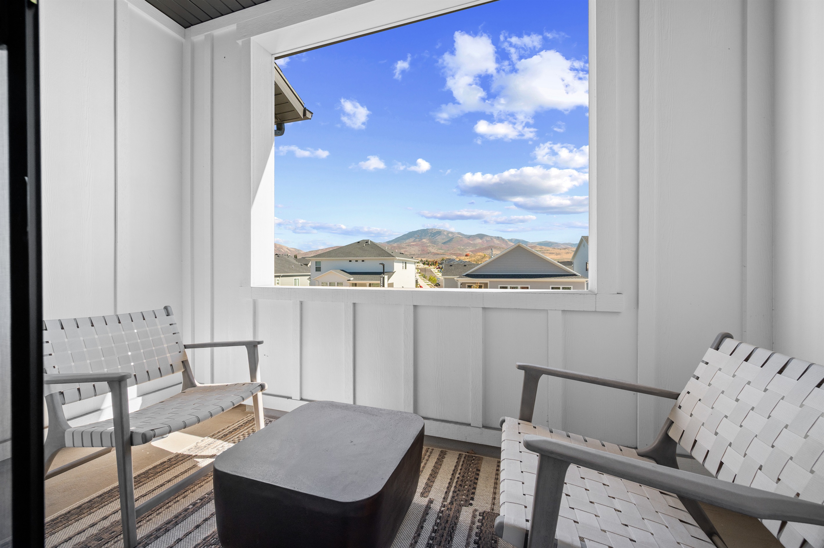Step out onto the private covered balcony and take in the mountain views.