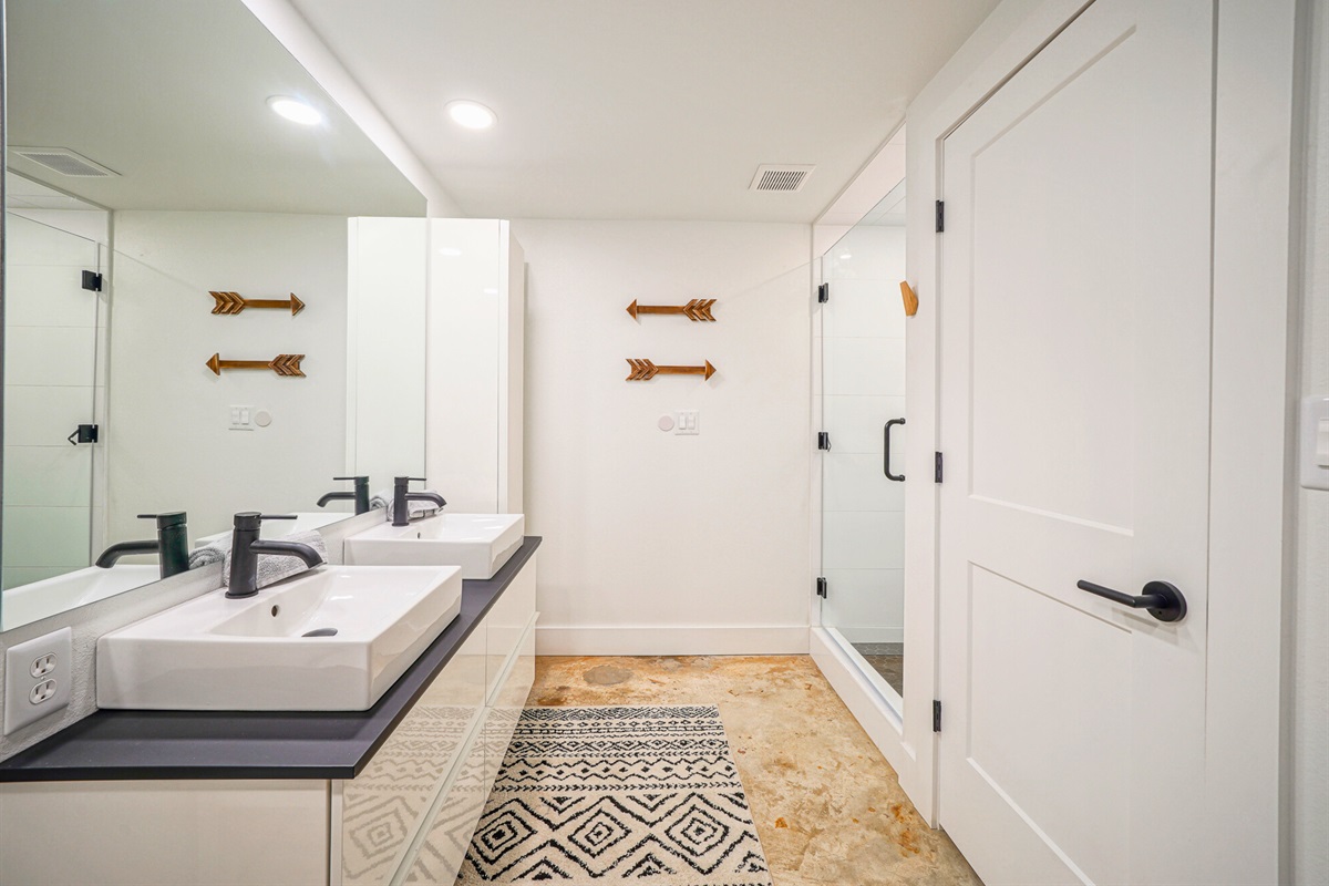 Mornings are smoother with dual sinks, crisp design, and stylish lighting that keeps things fresh and functional.