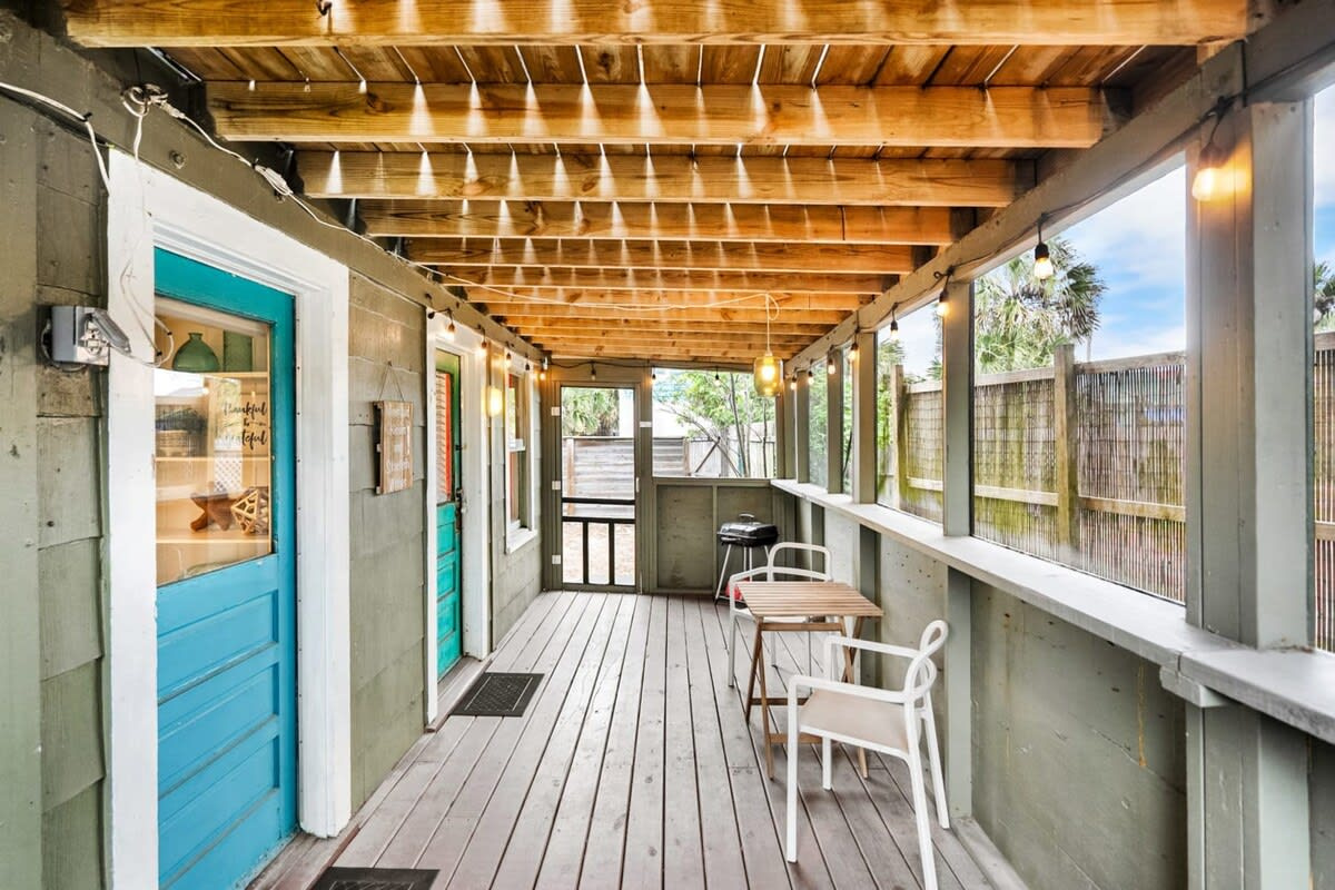 Looking down the length of the porch with the string lights waiting for dusk. This narrow, shady strip ends up being where most of the reading, most of the talking and most of the coffee actually happens.