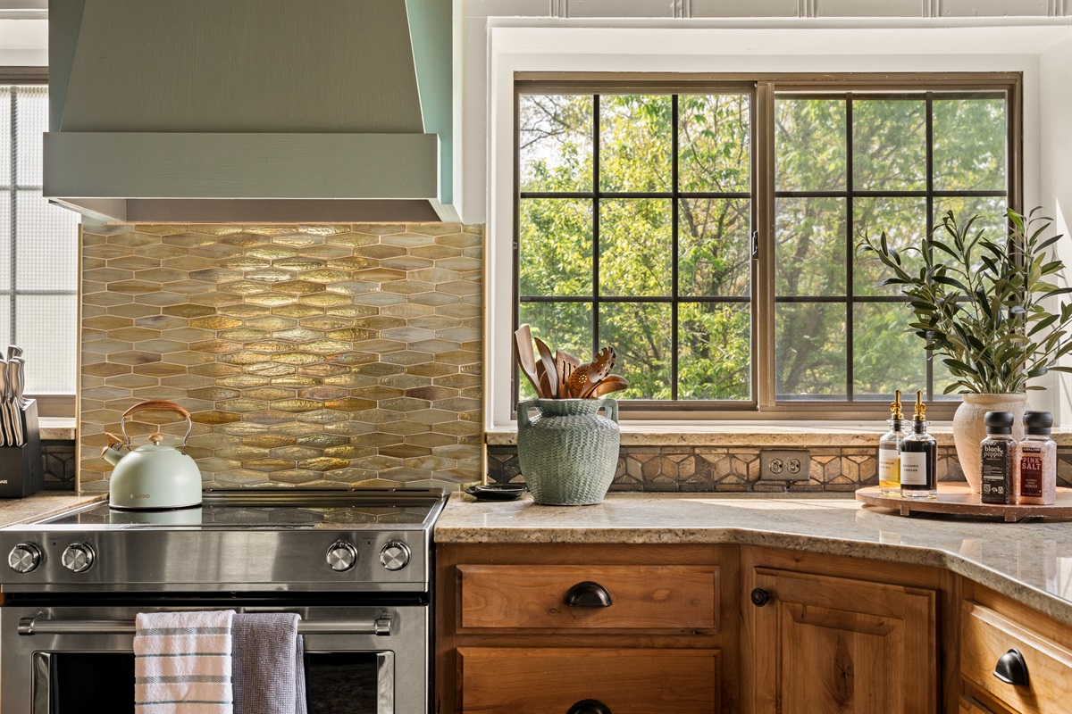 Beautiful finishes and warm tones bring character to this inviting kitchen.