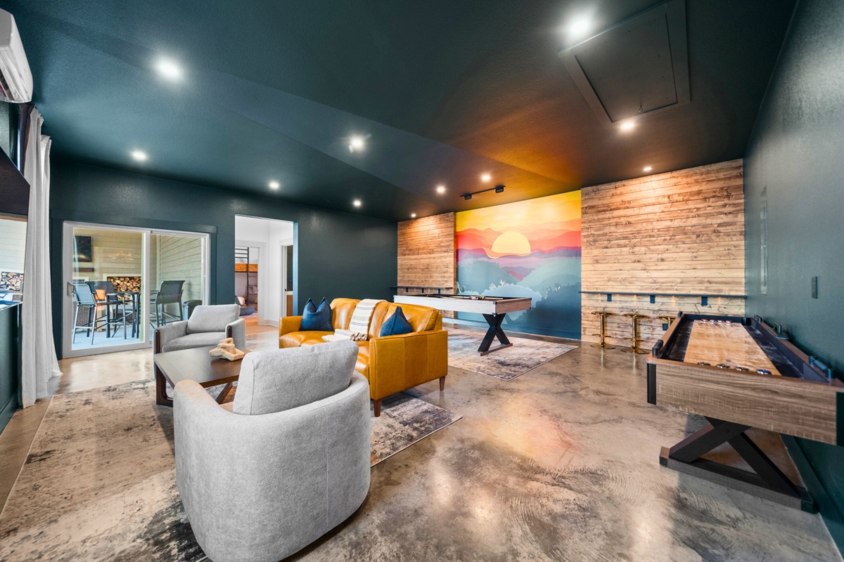 With plenty of room to spread out, this game room is ideal for everything from pool tournaments to relaxed evenings indoors.