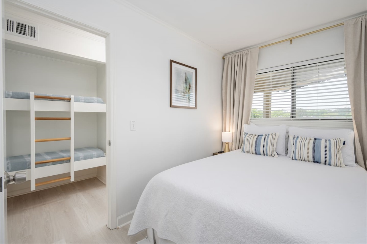 Private bedroom featuring a new ADJUSTABLE queen bed, closet, and nightstands. 