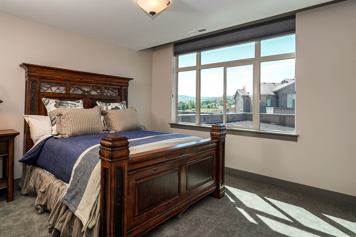 Comfortable upper-level bedroom with queen bed and private bath.