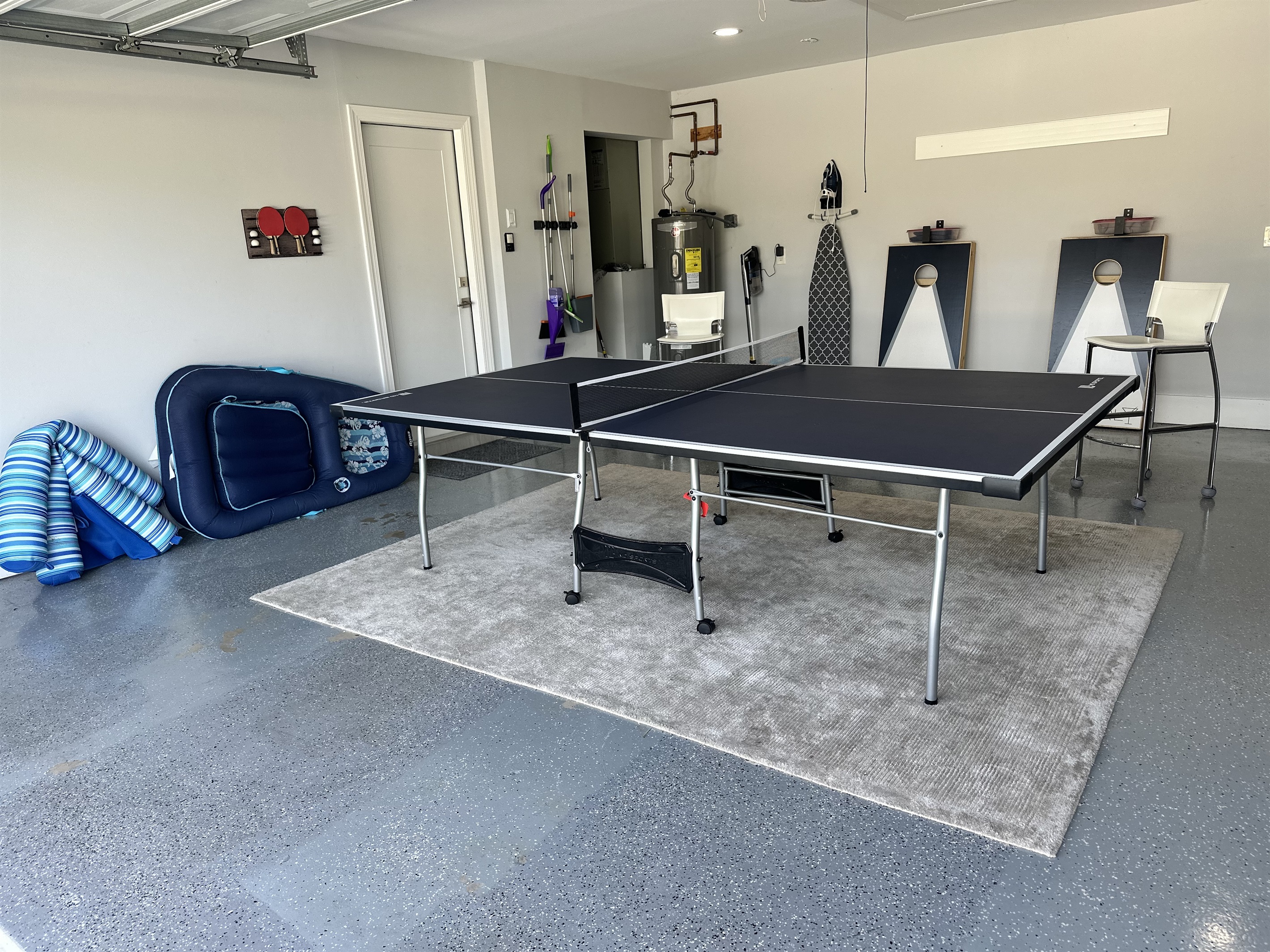 Ping pong in the garage and cornhole for of the backyard