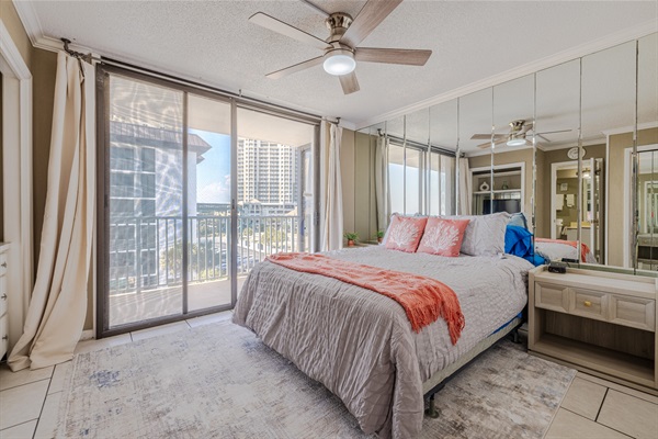 Master bedroom #2 with ensuite bath, ceiling fan, smart TV and balcony access