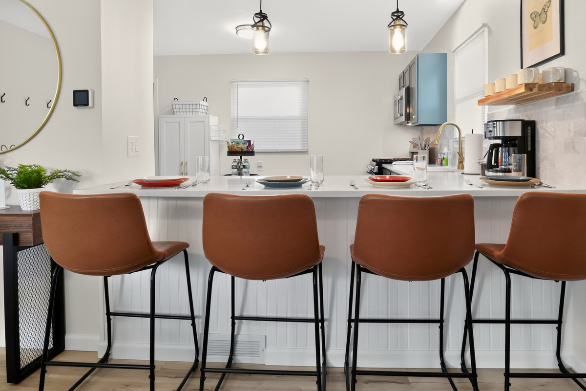 The kitchen island is a favorite spot for coffee, conversation, and casual meals.