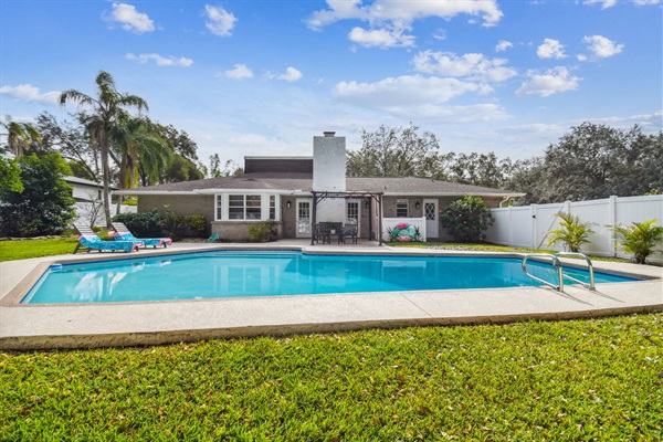 Sandhill House features a large heated pool for swimming or sunning.