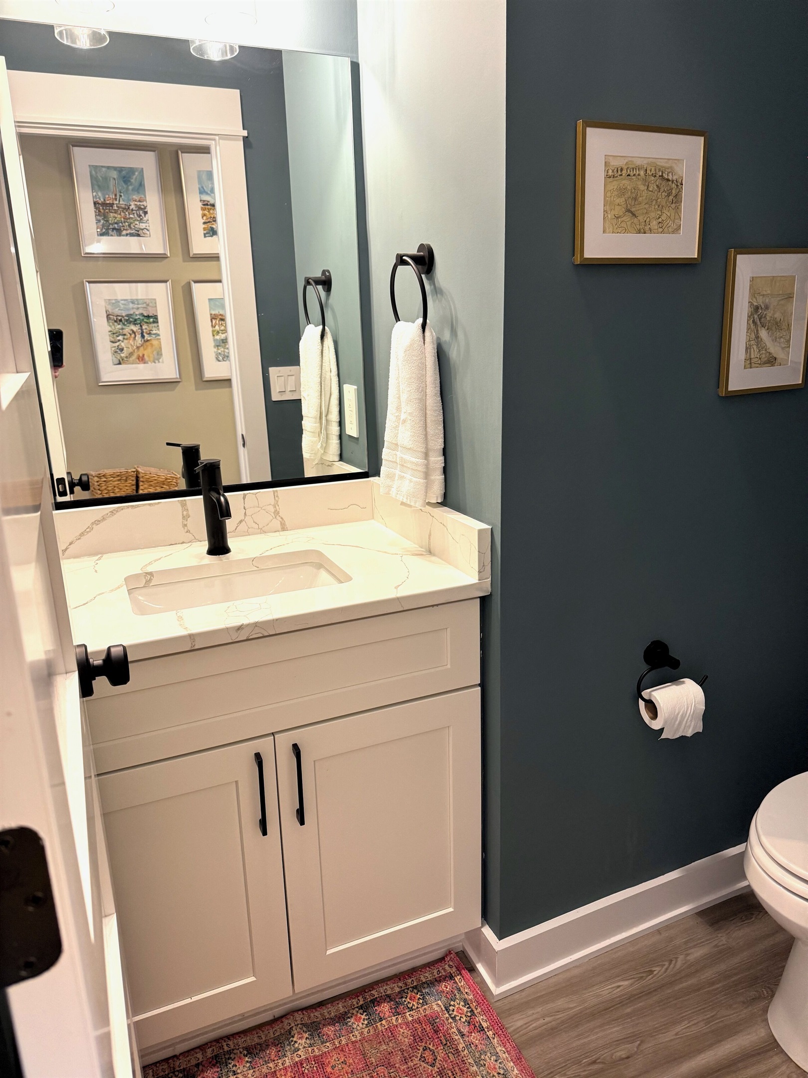 Half bath downstairs by entry