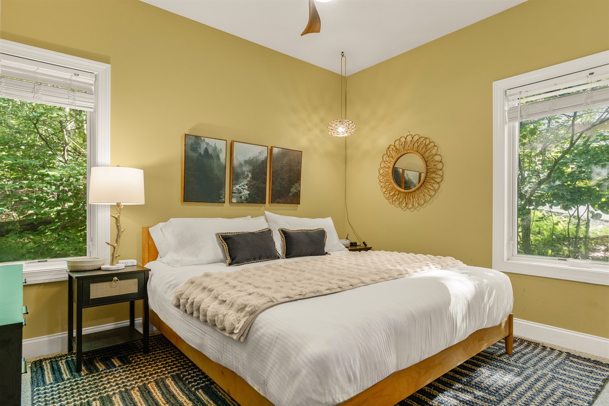 A stylish blend of boho and mid-century charm, this bright king suite offers morning light, soft textures, and a 55” TV—perfect for unwinding in effortless comfort