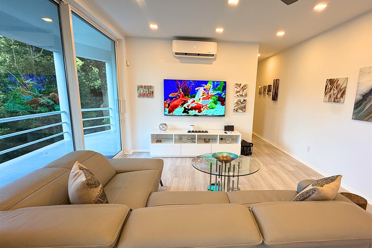 A smart TV with lots of seating is the perfect place for guests looking to relax