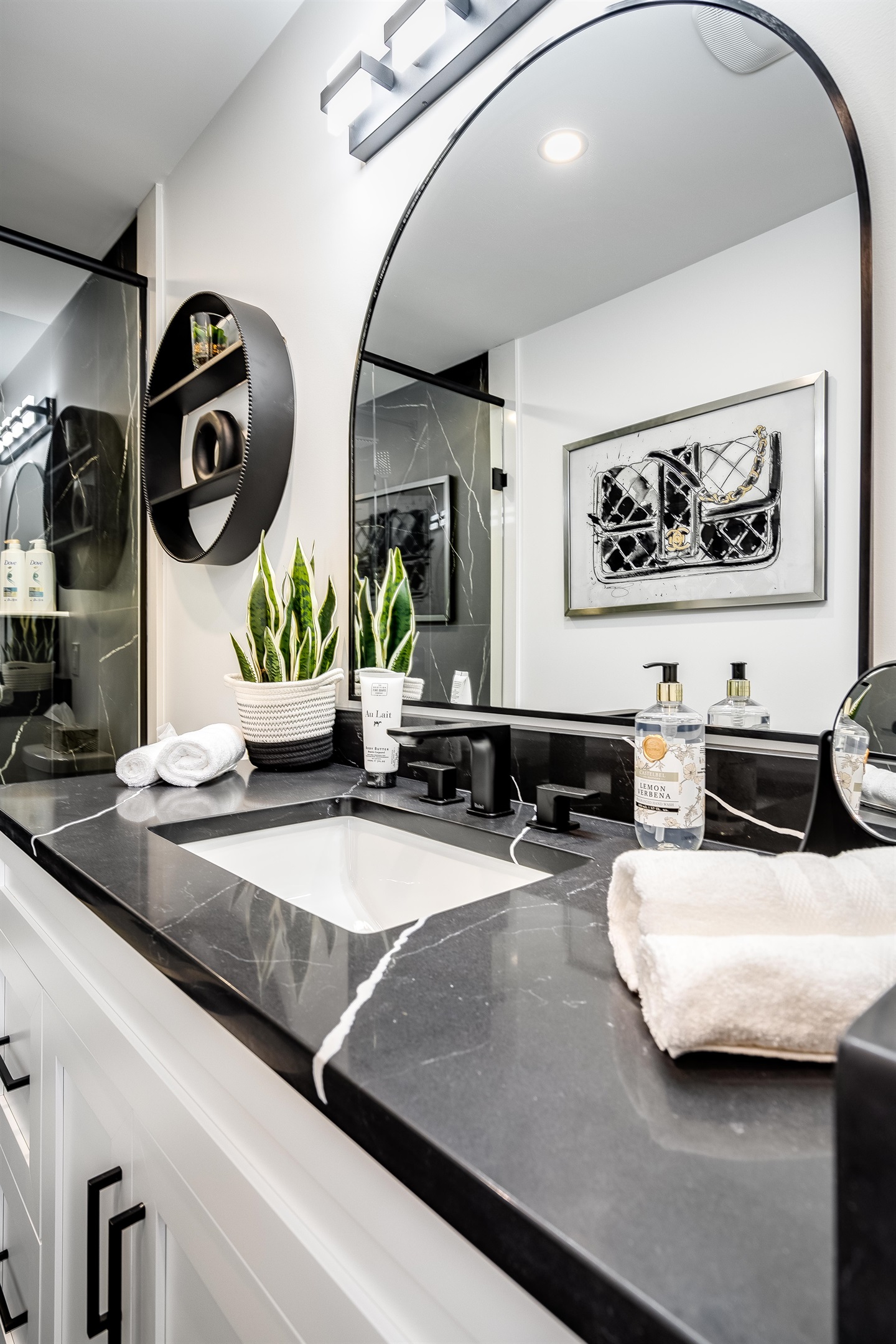 Full Bathroom with Warm accent lighting highlights architectural details.