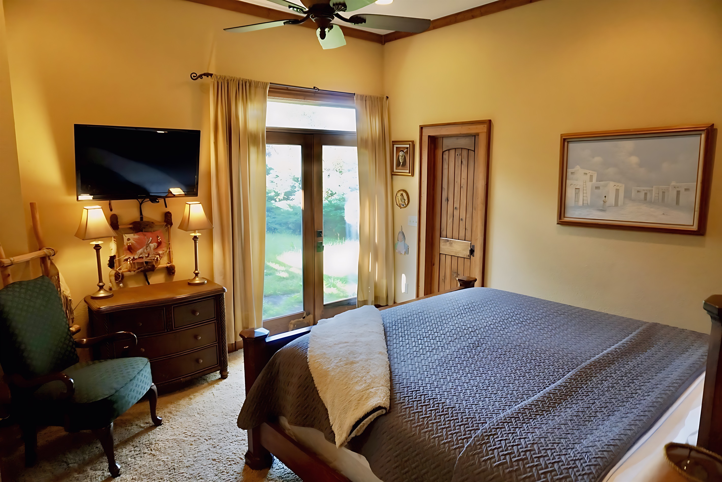 Cozy and inviting bedroom with a private balcony to enjoy the fresh air.