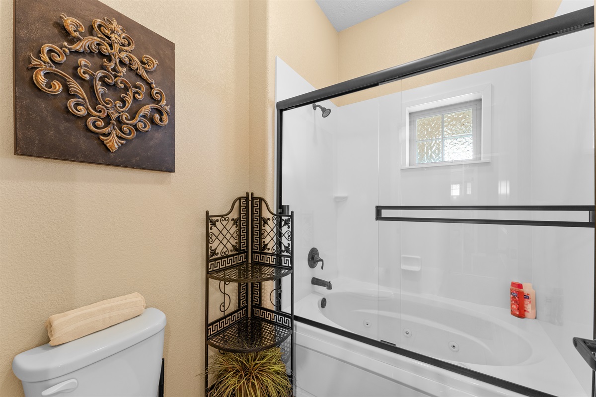 The attached bath includes a jetted tub/shower combo for an easy reset after a full Branson day.