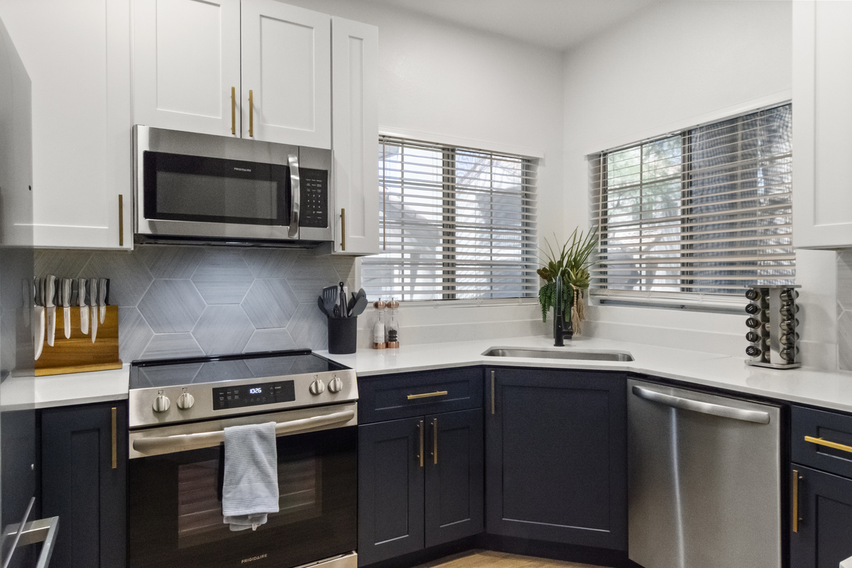 Modern kitchen with essential appliances for home-cooked favorites.