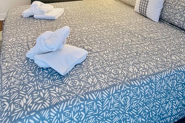 Fresh towels on the bed