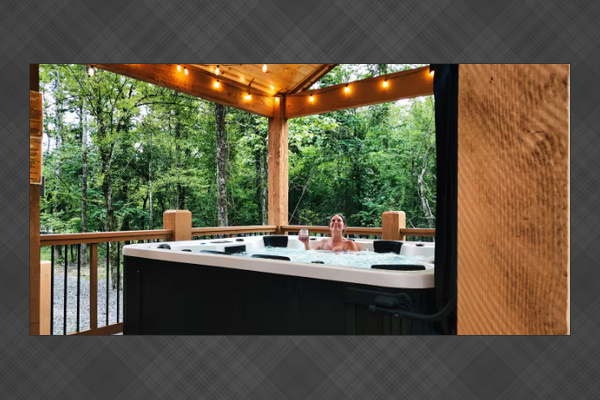 Covered hot tub with serene forest surroundings