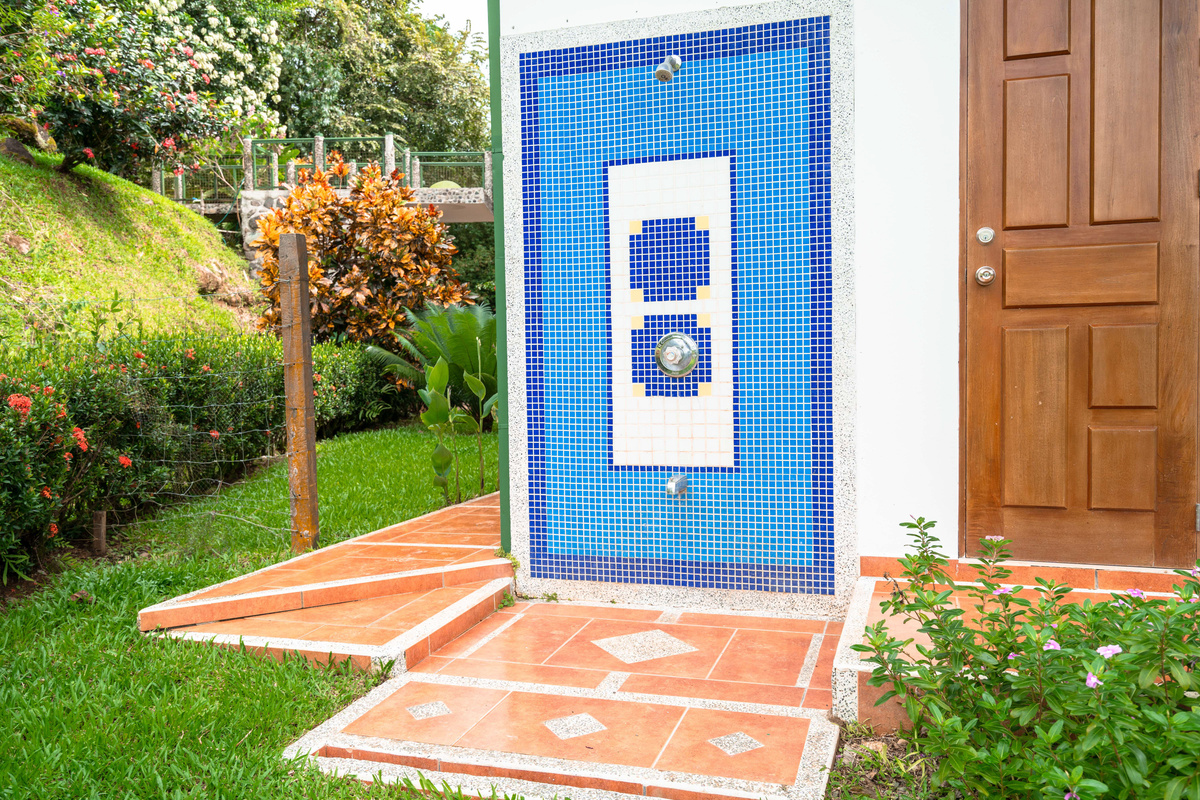 Outdoor shower and private entrance — built-in BBQ area and terrace access