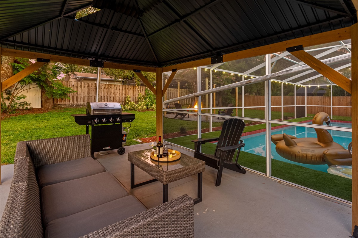 Rain or shine, this covered outdoor space keeps the good times going, offering shade, comfort, and a fantastic setup for outdoor living.