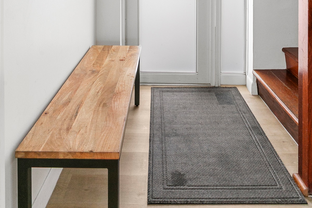 Private entrance foyer with storage space, easily accessible beach gear, and a bench